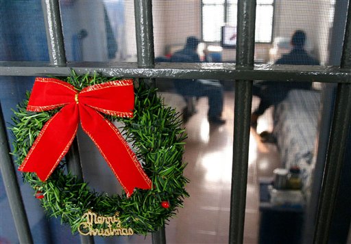 A Christmas wreath hangs on the gate of a dorm for foreign prisoners in a prison in China.