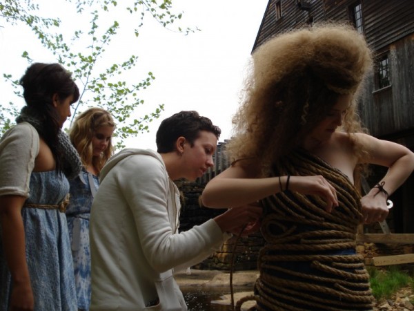 DSC05690 Designer Gennie Catastrophe adjusts a dress on a model during a photoshoot before the Art to Wear fashion show.