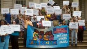 Protesters in City Hall want Alianza Dominicana saved.
